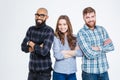 Multiethnic group of three confident smiling students