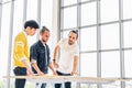 Multiethnic group of three men meeting discuss brainstorm project plan together, modern office with copy space Royalty Free Stock Photo