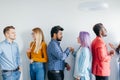 Multiethnic Group of Young People in Casual Wear isolated over grey background