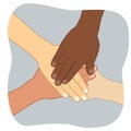 Multiethnic group of young people putting their hands on top of each other Royalty Free Stock Photo