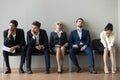Multiethnic job candidates tired of waiting in queue for intervi
