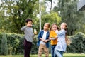 Multiethnic kids with soap bubbles standing