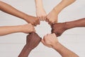 Multiethnic people holding hands in a circle together, multiethnic business team promising help and support, close-up Royalty Free Stock Photo