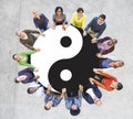 Multiethnic People Holding Hands with Yin Yang Symbol Royalty Free Stock Photo