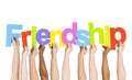 Multiethnic People Holding The Word Friendship Royalty Free Stock Photo