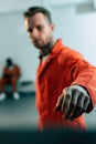 multiethnic prisoners in prison cell with hand