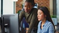 Multiethnic team of IT developers working on computers Royalty Free Stock Photo