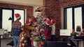 Multiethnic team of people putting christmas tree decor Royalty Free Stock Photo