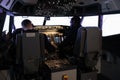Multiethnic team of pilots using control command to fly plane