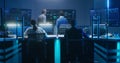 Team of IT technical specialists and software programmers work in monitoring office Royalty Free Stock Photo