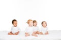 adorable multiethnic toddler boys and girls looking away