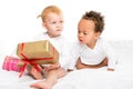 multiethnic toddlers with wrapped gifts