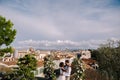 Multiethnic wedding couple. Destination fine-art wedding in Florence, Italy. A wedding ceremony on the roof of the