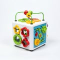 Multifunctional activity cube toy made of colorful plastic with various shapes and Royalty Free Stock Photo
