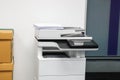 Multifunctional office laser printer for use in scanning and printing business documents in workplace