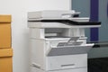 Multifunctional office laser printer for use in scanning and printing documents in workplace Royalty Free Stock Photo