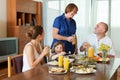 Multigeneration family communicate over table Royalty Free Stock Photo
