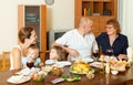 Multigeneration family communicate over table Royalty Free Stock Photo