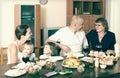 Multigeneration family communicate over table Royalty Free Stock Photo