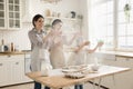 Multigenerational family having fun cooking in the kitchen Royalty Free Stock Photo