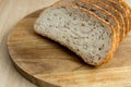 Multigrain bread. Fresh bakery. Slices of multigrain bread on a cutting board. Close-up. Royalty Free Stock Photo