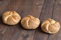 Multigrain Kaiser rolls on wooden background