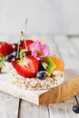 Multigrain rice cakes with berries, fruit and almond for healthy Royalty Free Stock Photo