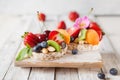 Multigrain rice cakes with berries, fruit and almond for healthy Royalty Free Stock Photo