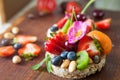 Multigrain rice cakes with berries, fruit and almond for healthy Royalty Free Stock Photo