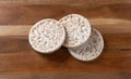 Multigrain rice cakes on wood cutting board Royalty Free Stock Photo