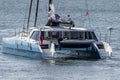 Multihull luxury sailboat Moonwave heading out of New Bedford under electric power