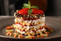 Multilayer waffle cake with ripe strawberries and whipped cream, decorated with mint and dark chocolate Royalty Free Stock Photo