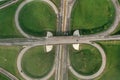 Multilevel transport interchange aerial view, clear sunny summer day, green grass. Summer industrial landscape