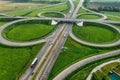 Multilevel transport interchange aerial view, clear sunny summer day, green grass. Summer industrial landscape