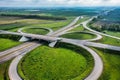 Multilevel transport interchange aerial view, clear sunny summer day, green grass. Summer industrial landscape