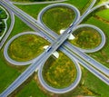 Multilevel transport interchange and green grass. top view