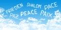 Multilingual peace message with cloud fonts on blue heaven background