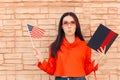 Student Holding Flag and Book Learning Foreign Language