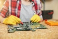 Beautiful caucasian young woman working in carpentry workshop at table place Royalty Free Stock Photo