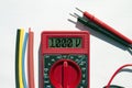 Multimeter with text on display 1000 V and heat shrink insulation on white background Royalty Free Stock Photo