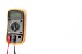 A multimeter with a yellow protective cover for measuring current. Royalty Free Stock Photo