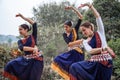 Multinational group of beautiful young classical odissi dancers wears traditional costume and posing Odissi dance mudra in the