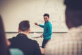 Multinational group of cheerful students taking an active part in a lesson while sitting in a lecture Hall. Royalty Free Stock Photo