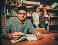 Multinational group of students studying in the university library Royalty Free Stock Photo