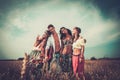 Multinational hippie friends in a wheat field