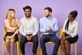 Multinational team smiling and congratulating their coworker