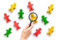 Multinationality concept. Socail research. People cutouts under magnifier on white background top-down pattern Royalty Free Stock Photo
