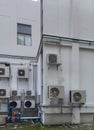 Multiple air conditioning units with fans on a office building exterior wall Royalty Free Stock Photo