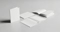 Multiple blank open and closed brochure mockups on gray surface Royalty Free Stock Photo