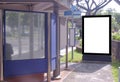 Multiple blank vertical advertising poster banner mockups at bus stop shelter by main road, at residential neighbourhood; out-of- Royalty Free Stock Photo